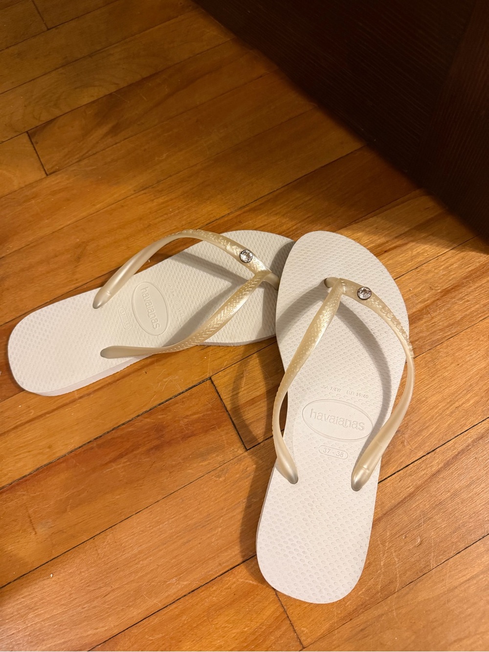 Havaianas Women’s Slim Flip Flops in White with Gold Straps and Crystal Accent